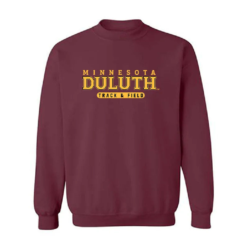 UMN Duluth - NCAA Women's Track & Field : Claire Becker - Classic Shersey Crewneck Sweatshirt Hoodie with Snap Buttons Easy Quick